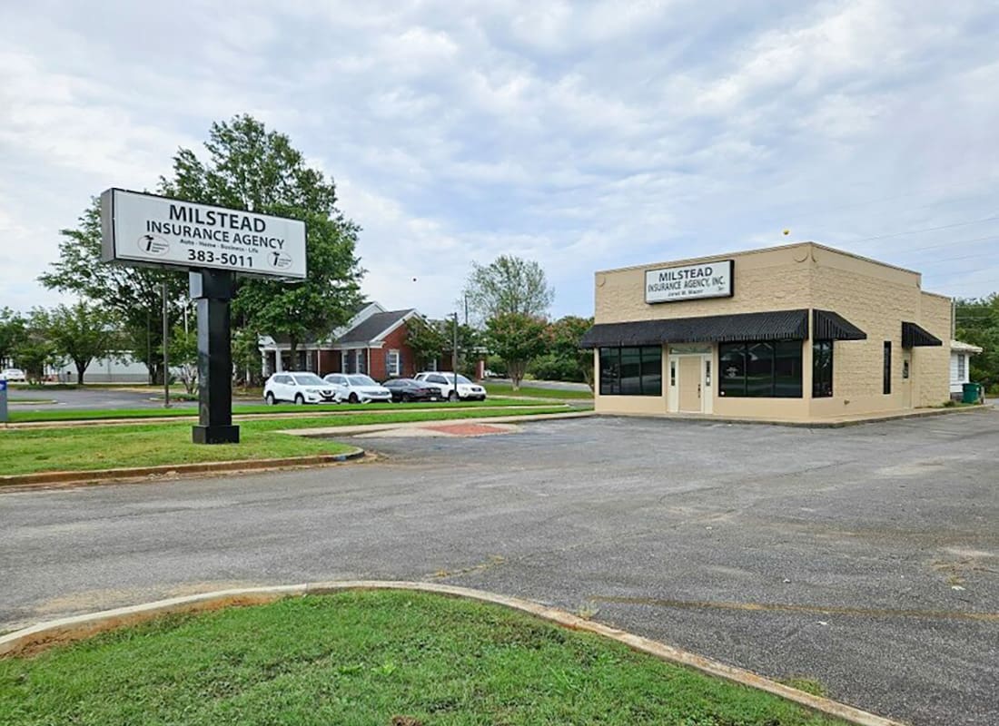 Sheffield, AL - View of the Milstead Insurance Agency Office Building and Sign with an Empty Parking Lot in Sheffield Alabama